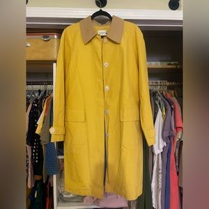 Long yellow raincoat with the light brown corduroy collar.